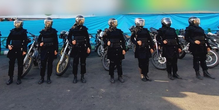 Members of the Women’s Police Special Unit pose in front of their motorcycles, February 2023.